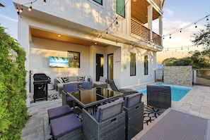 Outdoor dining - 5BR, 4.5BA Coastal Escape w/ Pool, Elevator, Near Beach & Attractions (Panama City Beach)