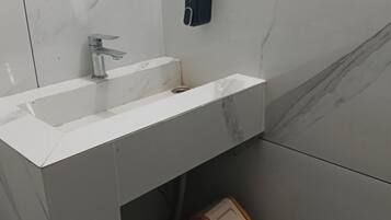 Shower, free toiletries, slippers, towels