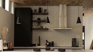 A modern kitchen with a wooden ceiling, white subway tiles, black pendant lights, and a bar area with stools. - Ökohaus Mont-Tremblant: Private Luxury Nordic Eco Cabin with Spa & Sauna (La Conception)