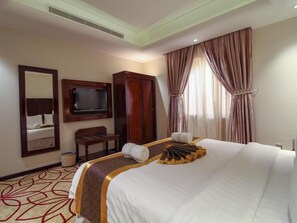 Coffres-forts dans les chambres, fer et planche à repasser