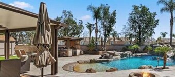 Enjoyable 4-bedroom house with a beautiful rock water fall slide swimming pool.