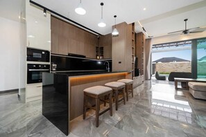 Luxury Villa, Pool View | Private kitchen - Baan Don 3 BR Pool Villa near Layan (Thep Krasattri)