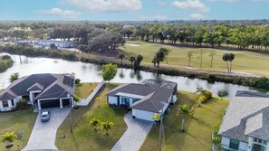Exterior - Tide & Tee Retreat~Heated Pool~Canal Kayaks~Golf Course Views~Sleeps 10 (Cape Coral)