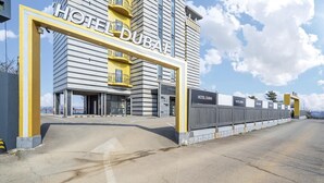 A modern hotel building with a prominent entrance and a clear view of the surrounding area. - Dubai Hotel Dangjin (Dangjin)