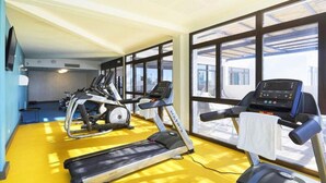 A gym with treadmills, elliptical machines, and a stationary bike. - House in Leucate by Beach & Lagoon (Leucate)