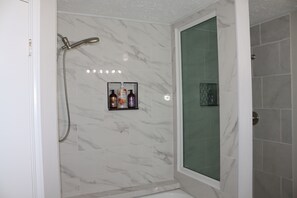 Shower, hair dryer, towels, soap