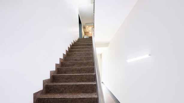 A staircase with a handrail, leading upwards in a modern building. - Fabhotel Fortune Residency - Nr Sarai Rohilla Railway Station (New Delhi)
