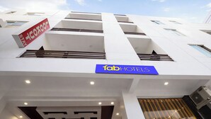 A hotel with a modern facade, a prominent 'fab hotels' sign, and a geometric pattern on the lower facade. - Fabhotel Lookout Stay (New Delhi)