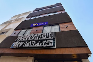 A hotel sign with 'HOTEL DP PALACE' and a 'TabHotels' sign above it. - Fabhotel Div Palace (Indore)
