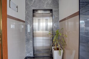 Elevator - Fabhotel Global Stay (Bangalore)