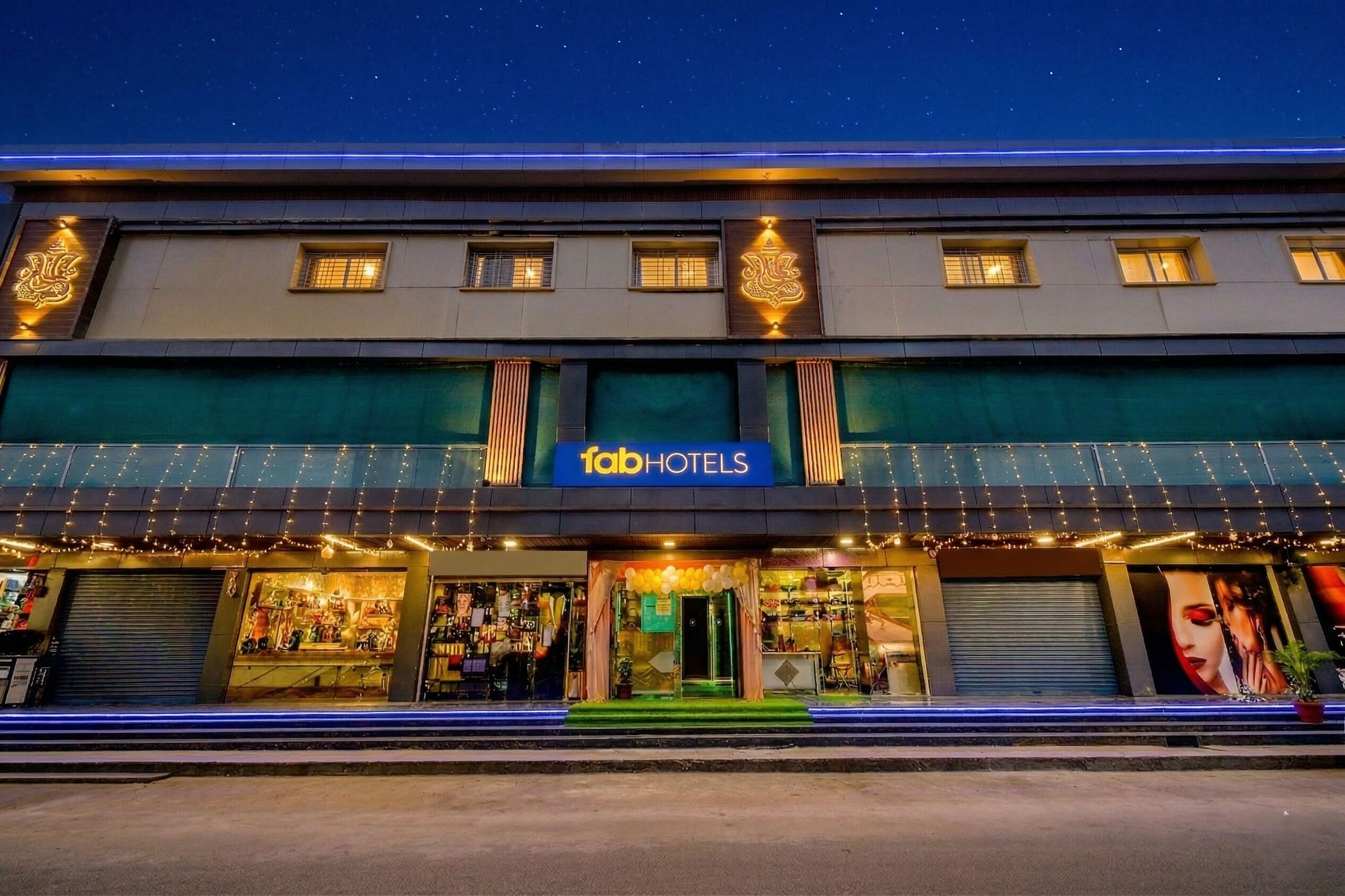 A hotel with a prominent sign, multiple windows, and a storefront with visible merchandise.
