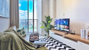 Apartment, 2 Bedrooms, City View | Living area | 43-inch Smart TV with cable channels