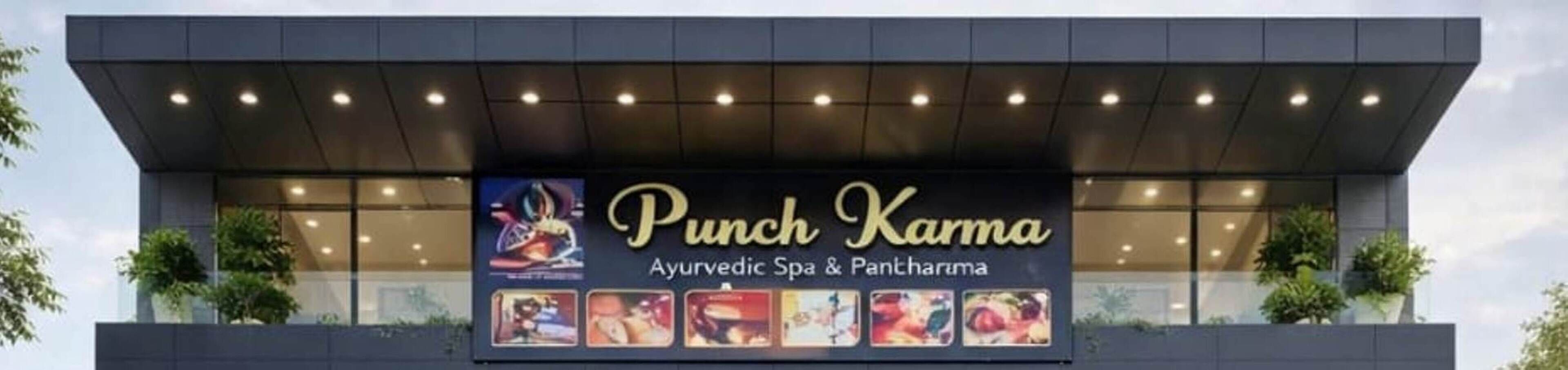A building with a sign for 'Punch Karma Ayurvedic Spa & Pantharma'.