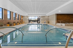 An indoor swimming pool with clear water, two lanes, and a lifeguard chair. - Drury Plaza Hotel Nashville Southeast Century Farms (Antioch)