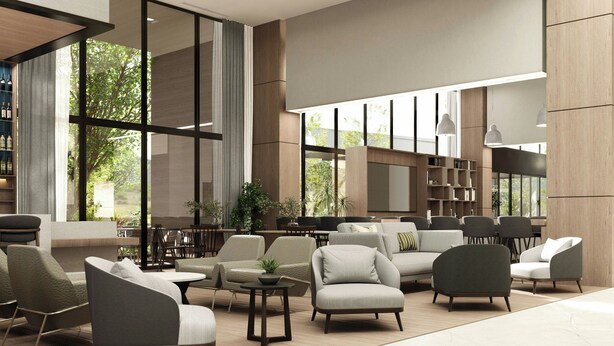 A spacious lobby with modern furniture, large windows, and a bookshelf. - Fairfield Inn & Suites San Luis Potosi Los Lagos (San Luis Potosi)