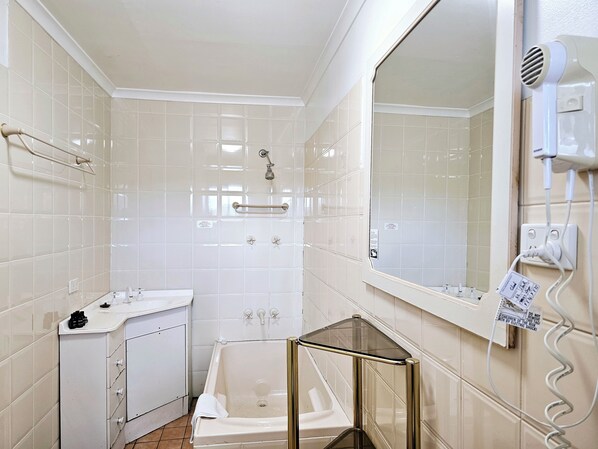 Shower, hair dryer, towels, soap