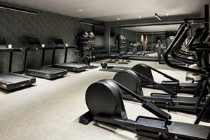 A modern gym with treadmills, elliptical machines, and free weights. - The Brandywine, Radnor, a Tribute Portfolio Hotel (Wayne)