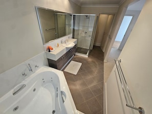 Shower, hair dryer, towels, soap