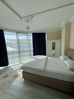 Family Suite, Mixed Dorm, City View | Laptop workspace, blackout drapes, iron/ironing board, free WiFi