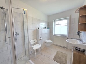 Shower, hair dryer, towels, soap