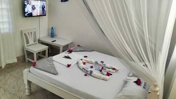 Classic Studio, Balcony, Garden View | Living area | 32-inch Smart TV with digital channels