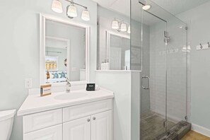 Shower, hair dryer, towels, shampoo