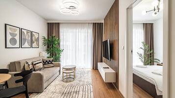 Apartamento, balcón | Sala de estar | Una Smart TV