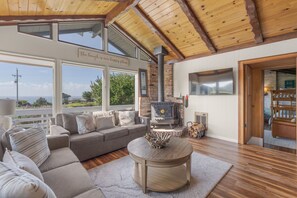 TV, fireplace, books - Irish Beach | Ocean Views, Hot-tub, Beach Access (Manchester)