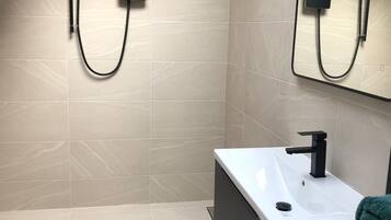 Shower, towels, toilet paper