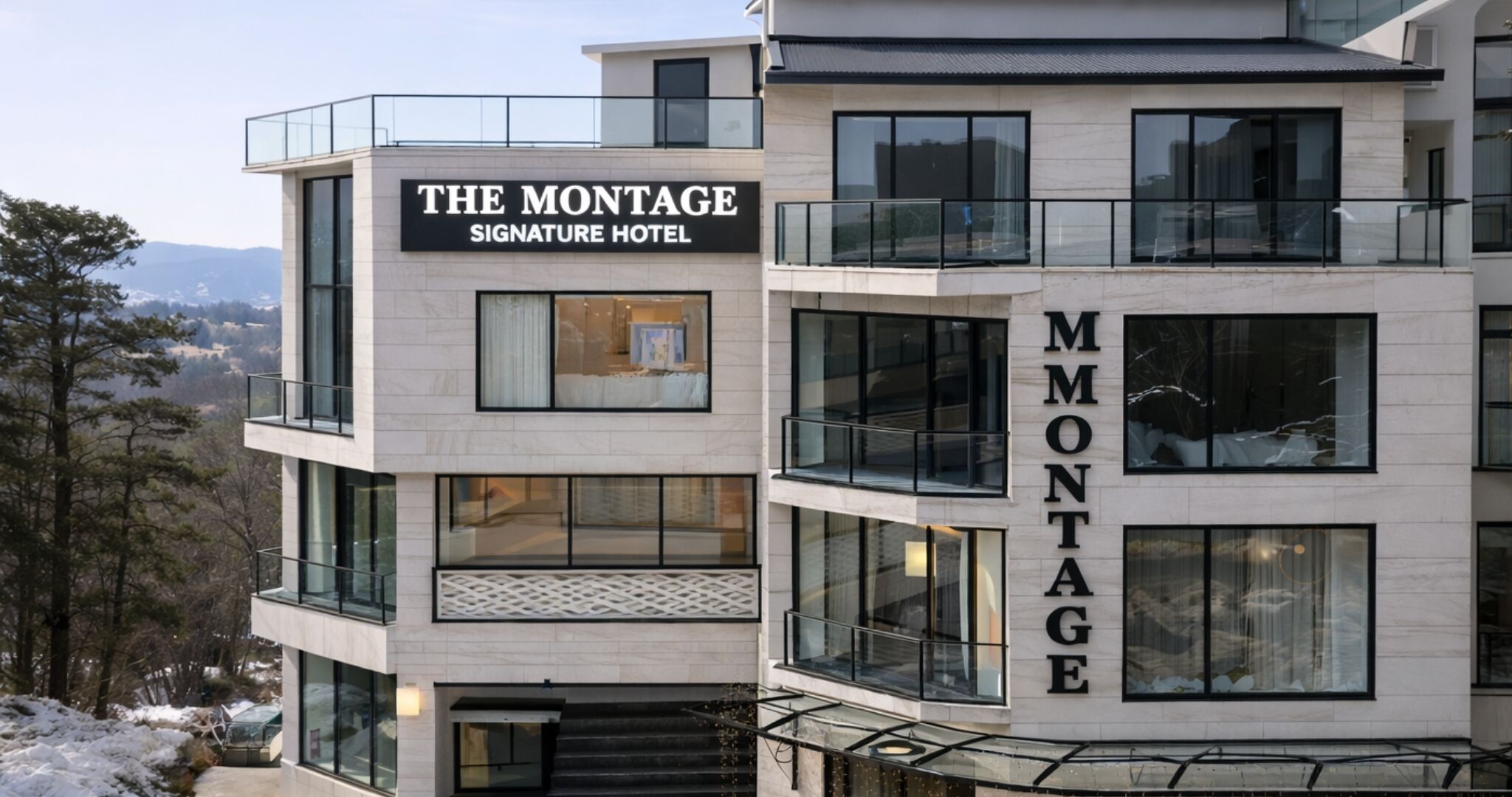 Un hotel de varios pisos con un letrero llamativo que dice 'THE MONTAGE SIGNATURE HOTEL'.