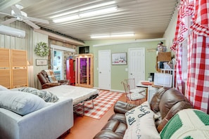A compact living space with a bed, a sofa, a small dining table, and a television. - 3 Mi to Dtwn: Wichita Falls Gem w/ Private Sauna! (Wichita Falls)