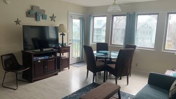 Signature Condo, 2 Bedrooms, Balcony, Garden View | Living room | 45-inch Smart TV with cable channels