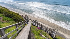 A coastal staircase leading to a beach with ocean views. - Private Bluff-Top Oceanfront Estate | Beach Access (Encinitas)
