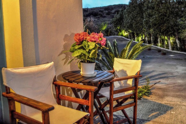 Outdoor patio seating with small table, ideal for morning coffee.