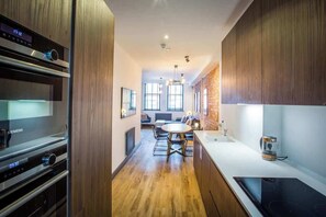 Fridge, microwave, oven, stovetop - Stay Awhile | Stylish Industrial 2BR Duplex, NQ (Manchester)