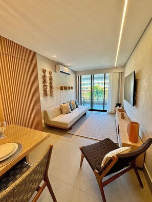 Departamento de lujo, vista al resort | Área de sala de estar