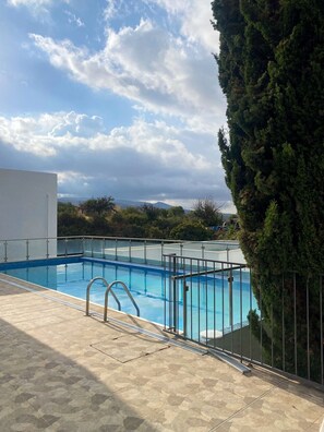 A swimming pool with a view of a mountain and trees. - 147 PEY - Stay Aloha Escape Apartment (Pegeia)