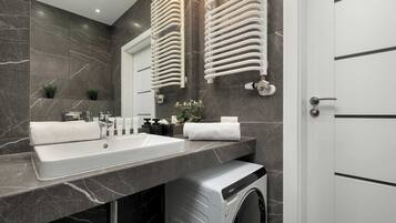 Shower, hair dryer, towels, shampoo