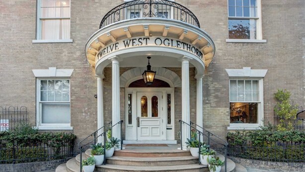 A building with a sign reading "TWELVE WEST OGLETHORPE" above the entrance. - 1872 Historic King Suite | Live Oak Views! (Savannah)