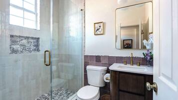 Shower, hair dryer, towels, shampoo