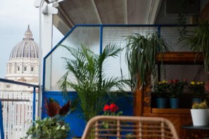 Family Quadruple Room, Balcony, City View | Property grounds