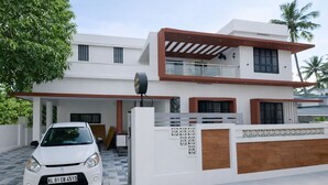 Ein modernes, zweistöckiges Haus mit weißer Fassade, einer Garage und einer Satellitenschüssel.