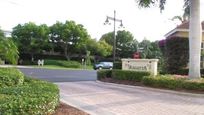 A residential area with a sign reading "Regatta." - Regatta at Vanderbilt Beach | Pool | Walk to Gulf (Naples)