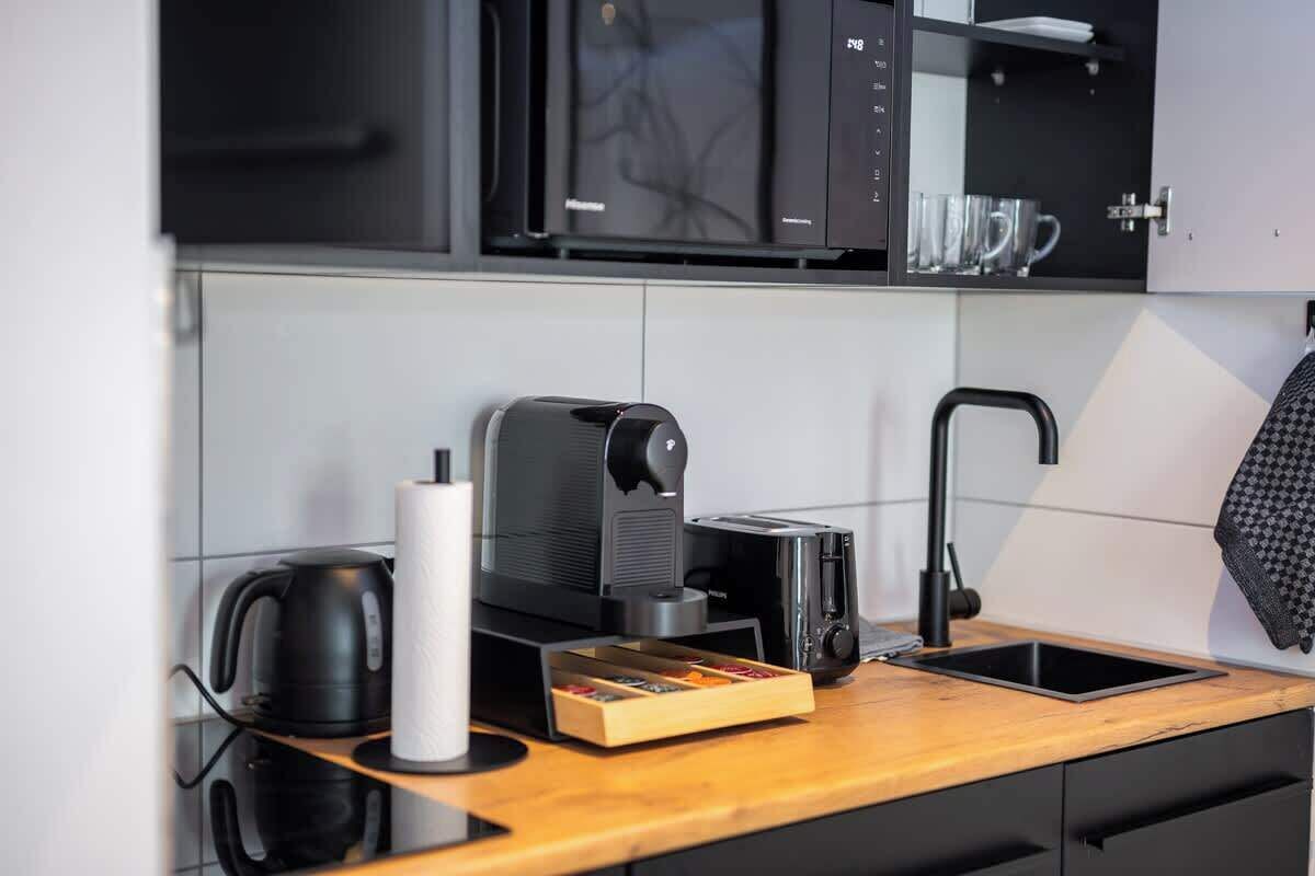 Fridge, microwave, stovetop, coffee/tea maker