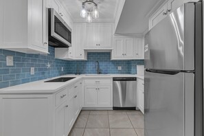 Fridge, microwave, stovetop, dishwasher - Happy As Clam Lower: 2 Bedroom Duplex Across From Ocean w/ View (Kure Beach)