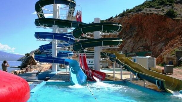 A water park with multiple slides and a pool. - Apartments Macolić Rab (Rab)