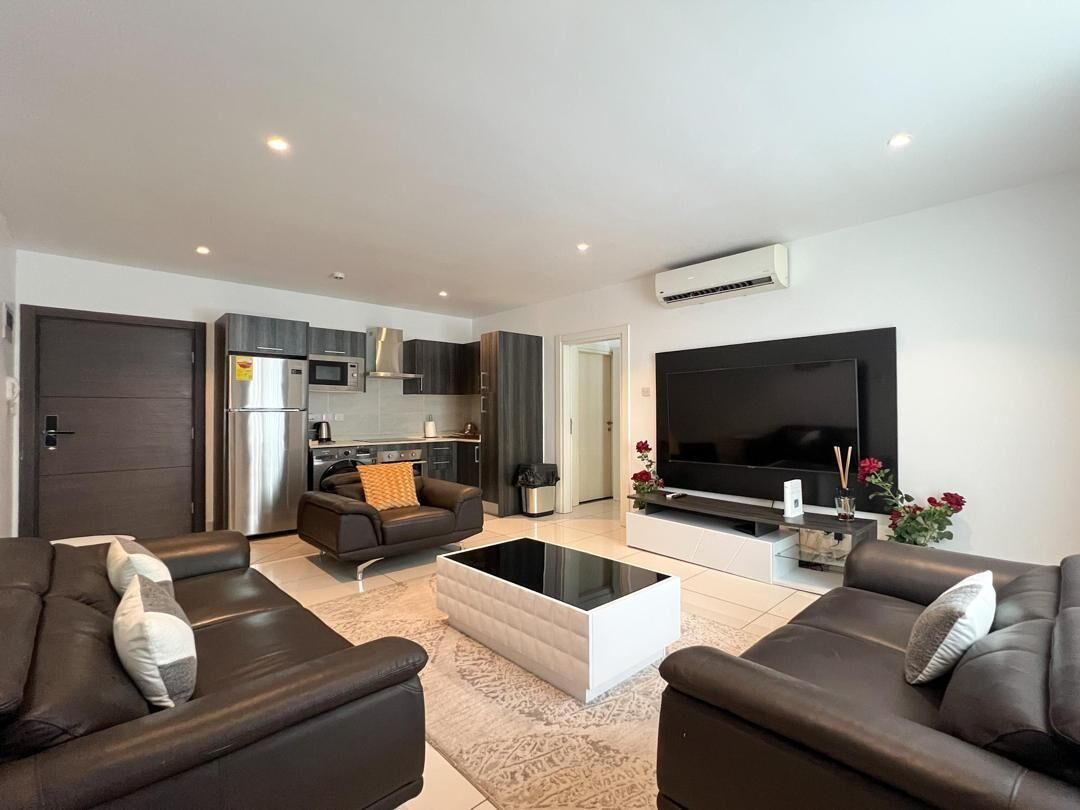 Deluxe Apartment, Balcony, Pool View | Living area | 52-inch Smart TV with satellite channels