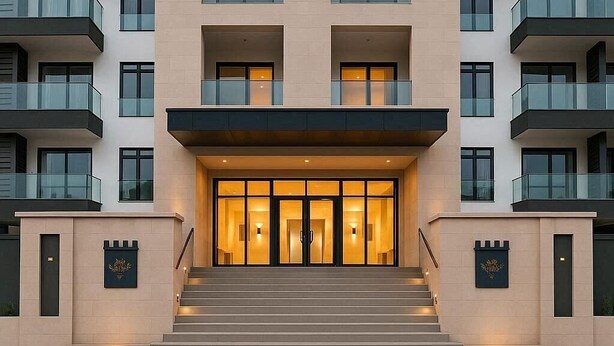 A multi-story hotel with a central entrance, balconies, and a modern architectural design. - Opulent 1 Bedroom suite in Embassy Gardens (Accra)