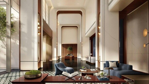 A spacious lobby with a modern design, featuring a central seating area with a sofa and armchairs, a coffee table, and a decorative plant. - Doubletree By Hilton Nantong Haimen (Nantong)