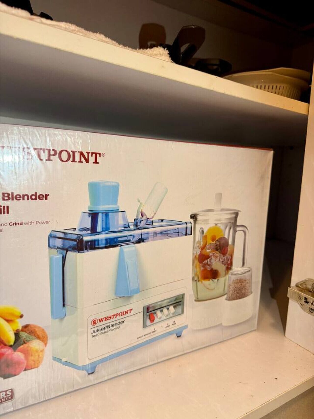 A Westpoint blender in its packaging on a shelf.